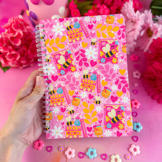 Hand holding bumble bee journal