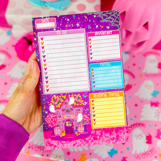 A halloween notepad with sections for a to do list, important items, notes, and reading things. Featuring a halloween bookshop in the lower left corner and a spider web in the top right corner.
