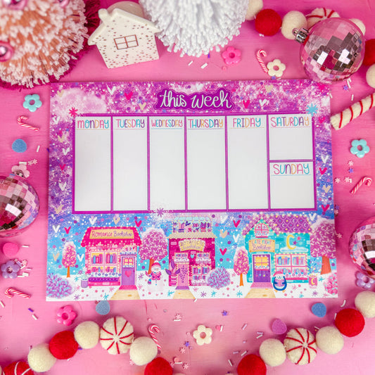 A weekly planner notepad with "this week" at the top and 3 winter themed bookshops along the bottom.